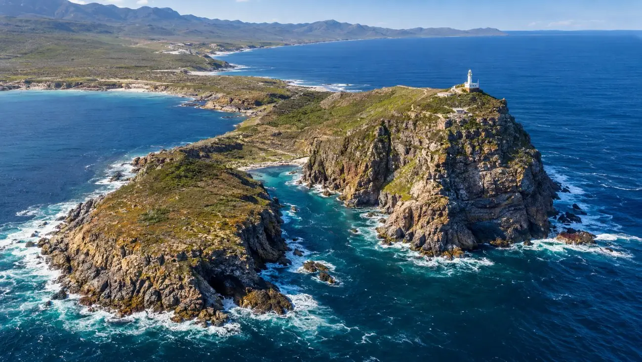 Two rocky headlands side by side at the tip of the Cape Peninsula, the higher one with a lighthouse